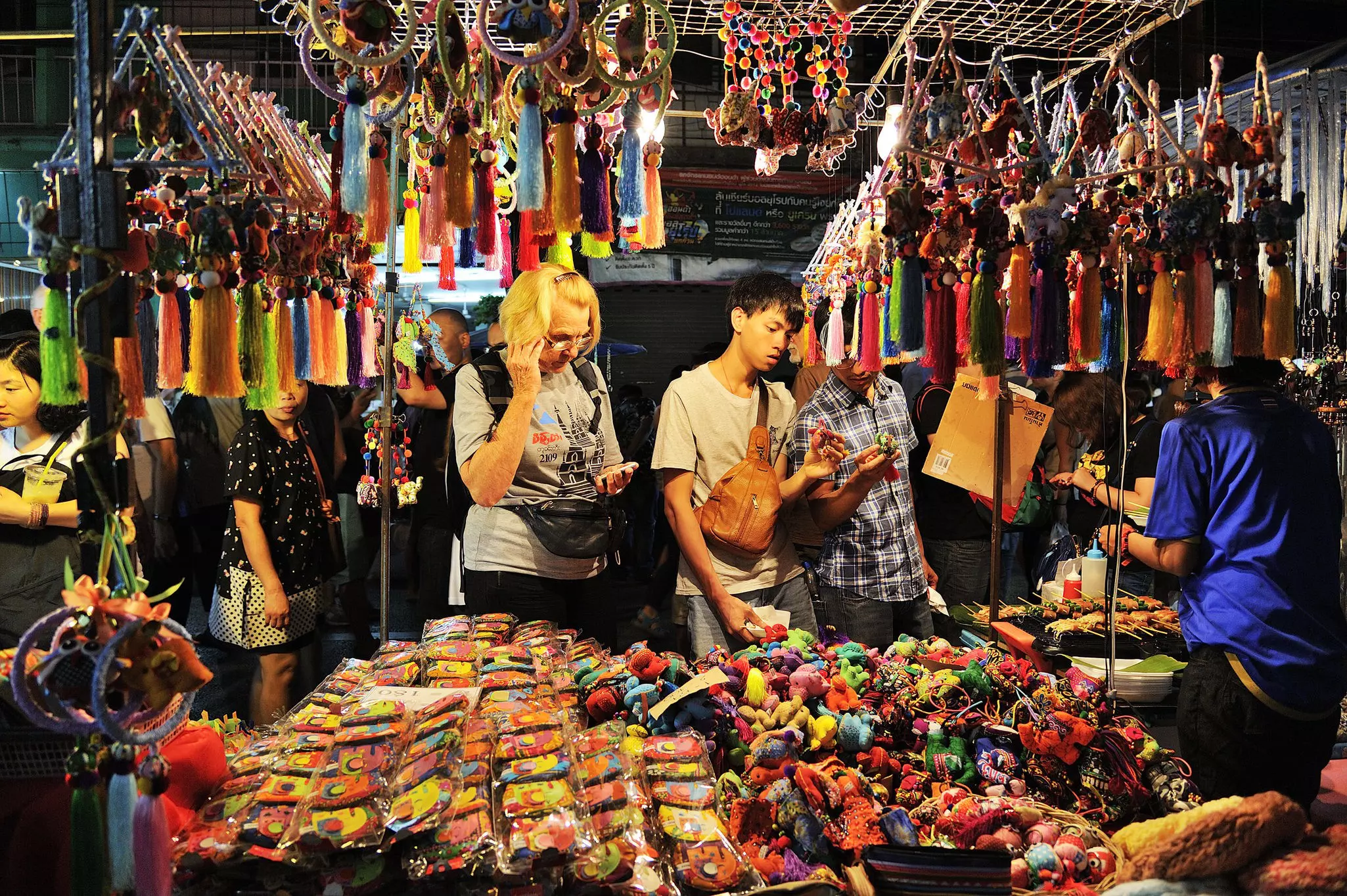 Customers looking at goods, Saturday market Walking Street, Chiang Mai ©501room/Shutterstock