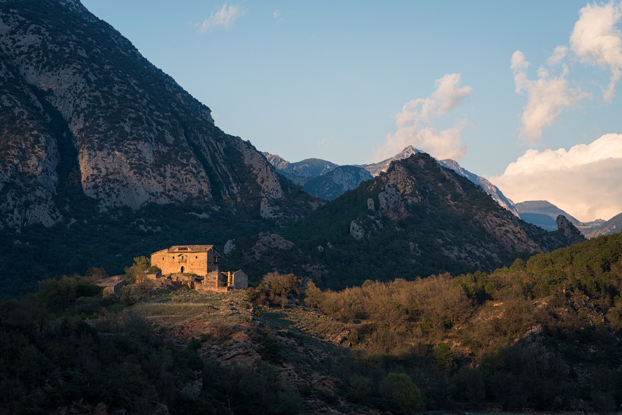 Farmhouse in mountains.