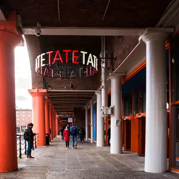 People walking into the Tate Liverpool art gallery in England