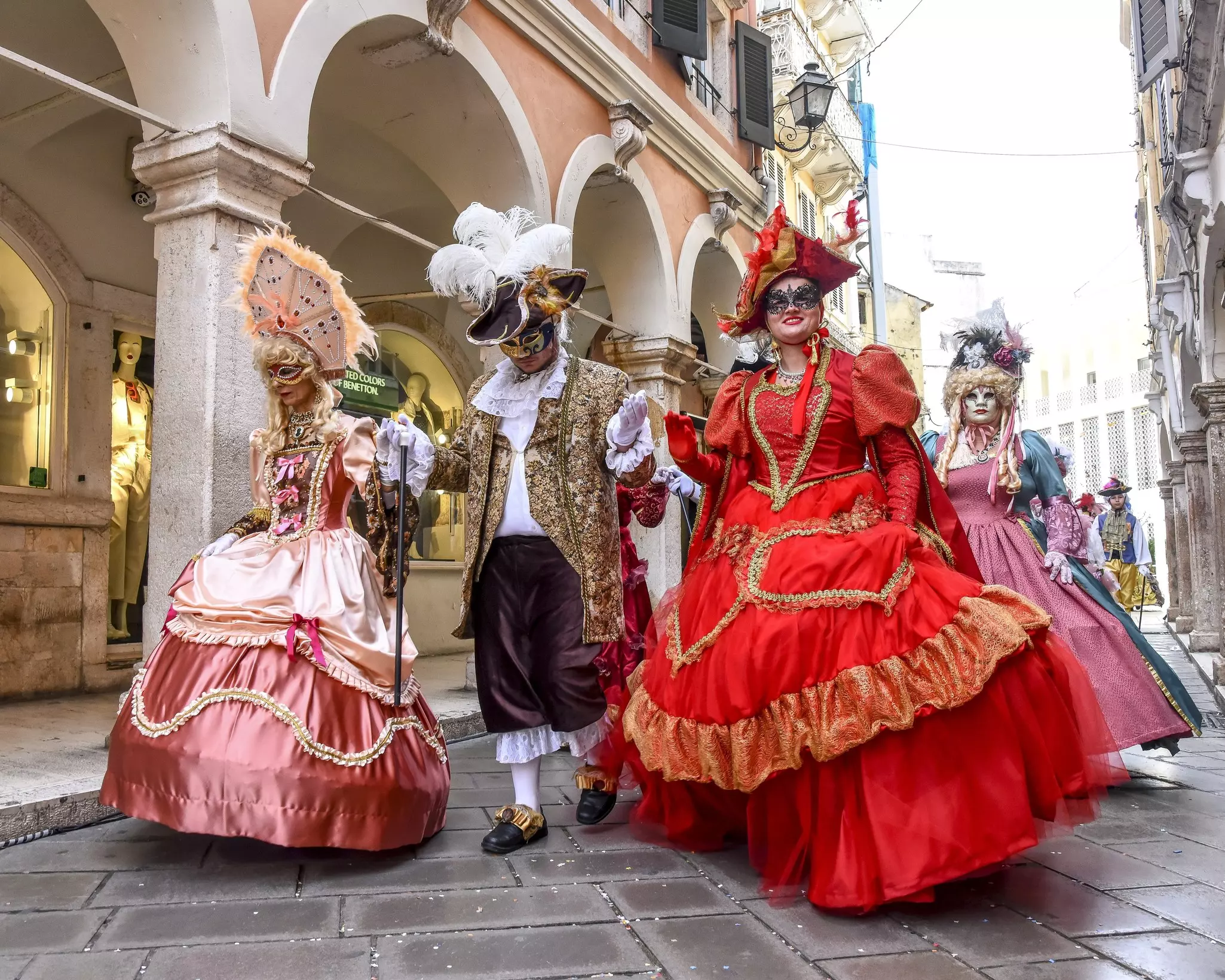 CORFU, GREECE - MARCH 10 2024 - Famous Traditional Venetian Carnival in Corfu - Handmade Masks and Costumes, Mask human images - Beautiful colored carnival costume on the street in Corfu