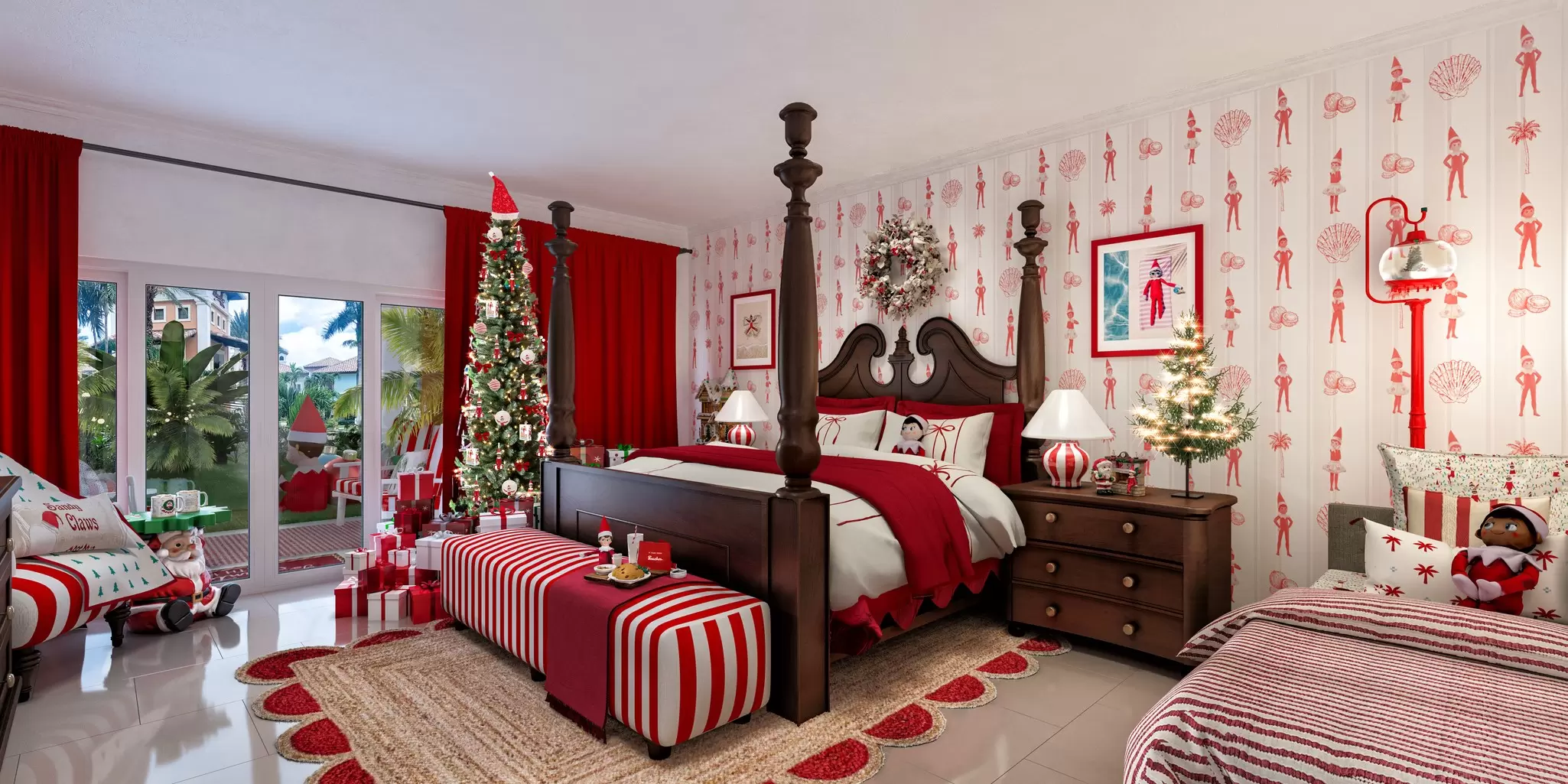 A hotel room decorated in red and white with elves planted all over, including on the wallpaper. A narrow Christmas tree stands by the window beside the large four-poster bed