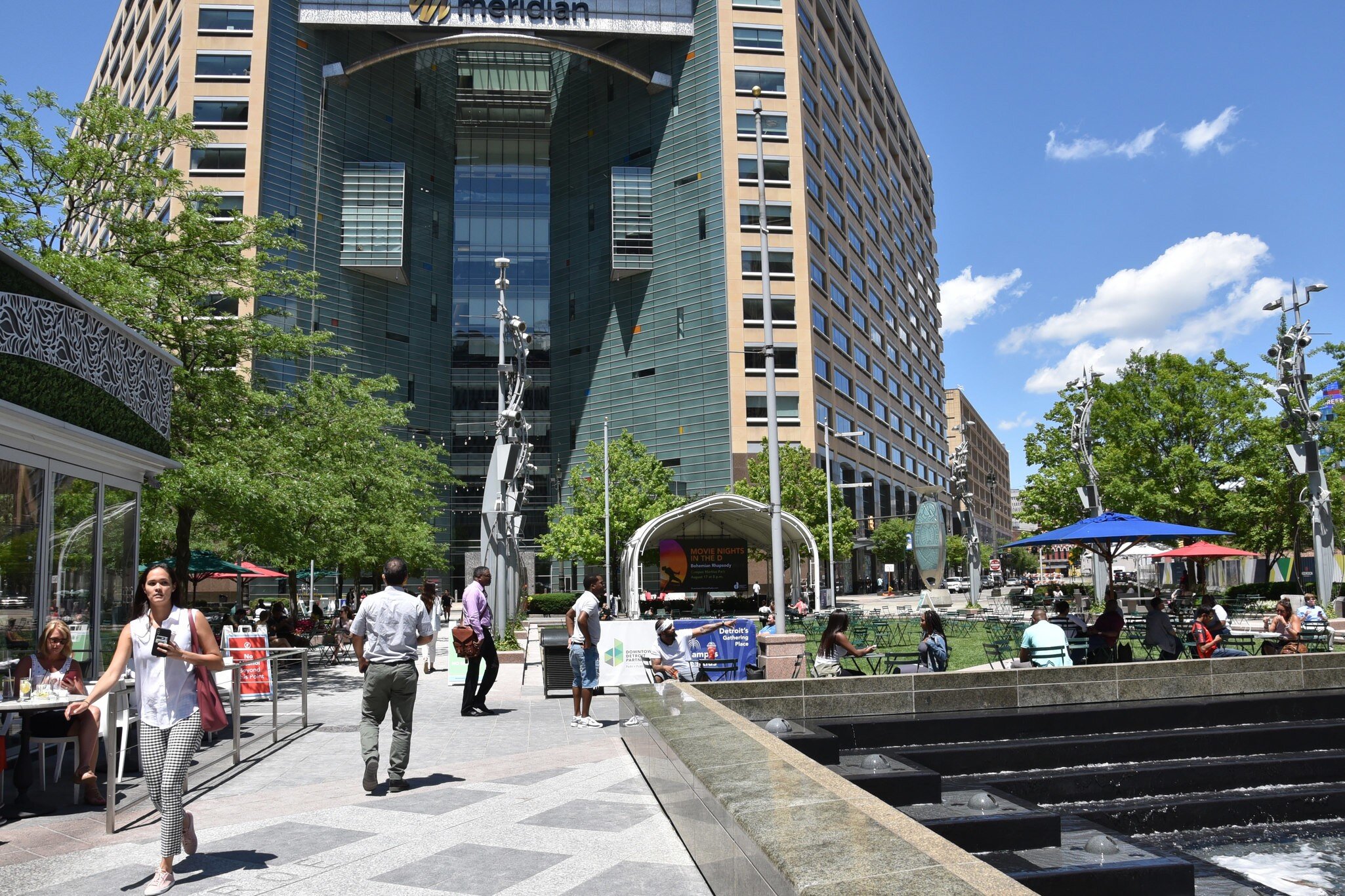 JUNE 30, 2019: Pedestrians walking around Campus Martius park.