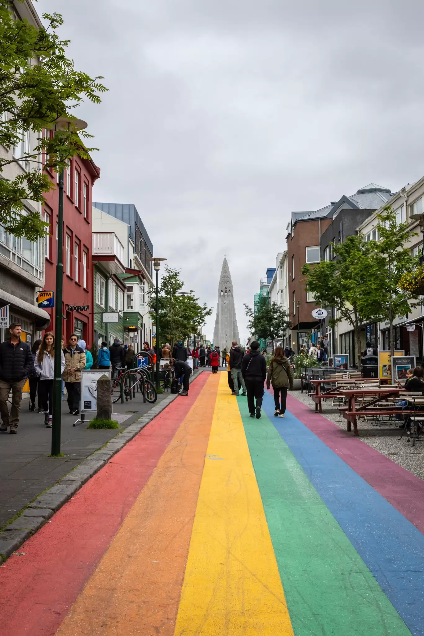 Reykjavik, Iceland - August 8, 2024: Tourists walking along the famous rainbow road in Reykjavik. , License Type: media, Download Time: 2025-12-09T22:31:57.000Z, User: Norma.PrauseBrewer_LonelyPlanet, Editorial: true, purchase_order: 56530 - Guidebooks, job: Global Publishing WIP, client: Europe 5, other: Norma Brewer