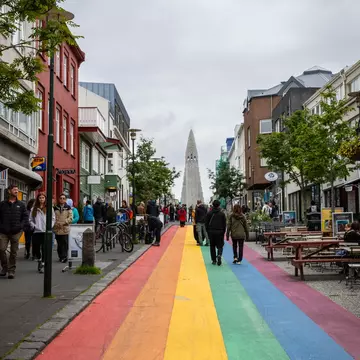 Reykjavik, Iceland - August 8, 2024: Tourists walking along the famous rainbow road in Reykjavik. , License Type: media, Download Time: 2025-12-09T22:31:57.000Z, User: Norma.PrauseBrewer_LonelyPlanet, Editorial: true, purchase_order: 56530 - Guidebooks, job: Global Publishing WIP, client: Europe 5, other: Norma Brewer