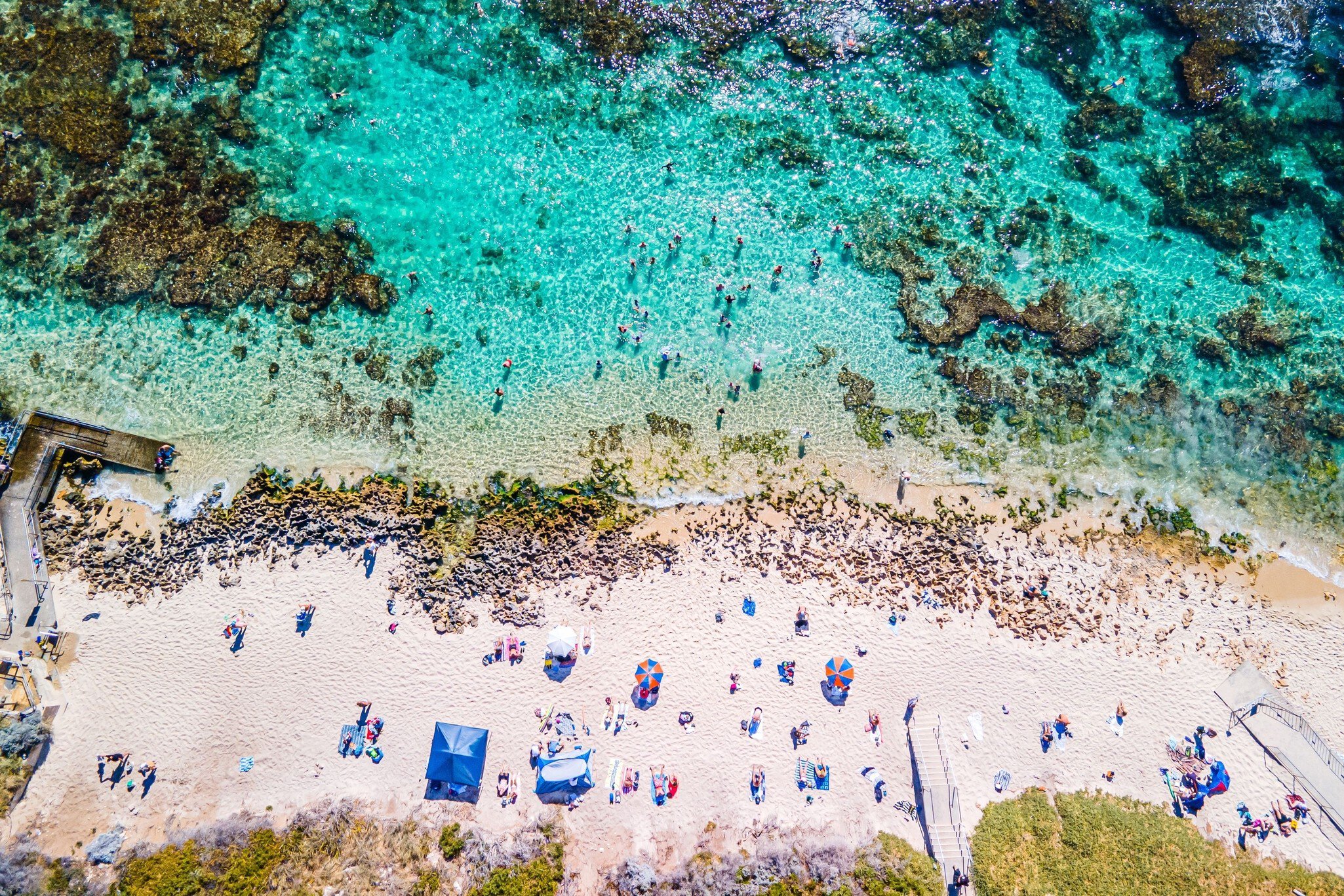 An aerial view of Mettams Pool in Perth, Western Australia, a picturesque beachside spot  License Type: media  Download Time: 2024-04-03T17:21:01.000Z  User: nic.dhoedt_lonelyplanet  Is Editorial: No  purchase_order:   