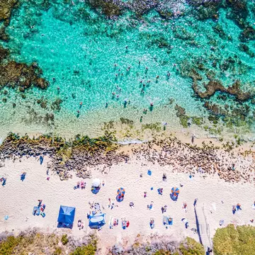 An aerial view of Mettams Pool in Perth, Western Australia, a picturesque beachside spot  License Type: media  Download Time: 2024-04-03T17:21:01.000Z  User: nic.dhoedt_lonelyplanet  Is Editorial: No  purchase_order:   