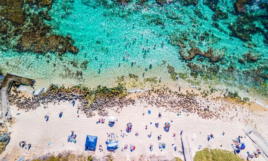 An aerial view of Mettams Pool in Perth, Western Australia, a picturesque beachside spot  License Type: media  Download Time: 2024-04-03T17:21:01.000Z  User: nic.dhoedt_lonelyplanet  Is Editorial: No  purchase_order:   