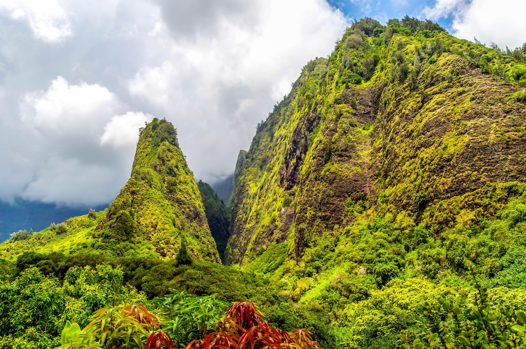 The towering monolith covered in tropical plant life known as the 'lao Needle in the West Maui Mountains, Hawaii.; Shutterstock ID 388732213; purchase_order: 65050; job: ; client: ; other: