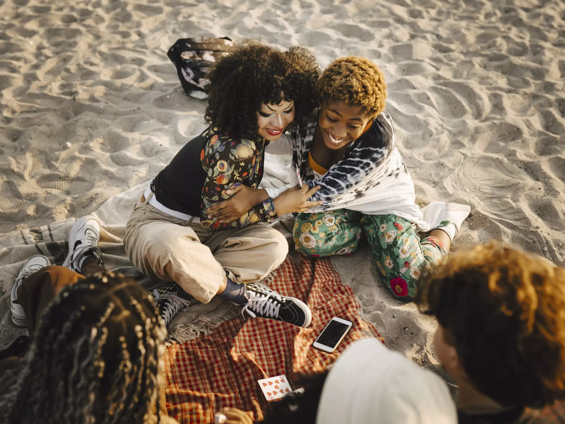 Sweden's long coastline means you're spoilt for choice when it comes to beaches
1350226885
beach, black woman, non binary person, braids, smiling, friends