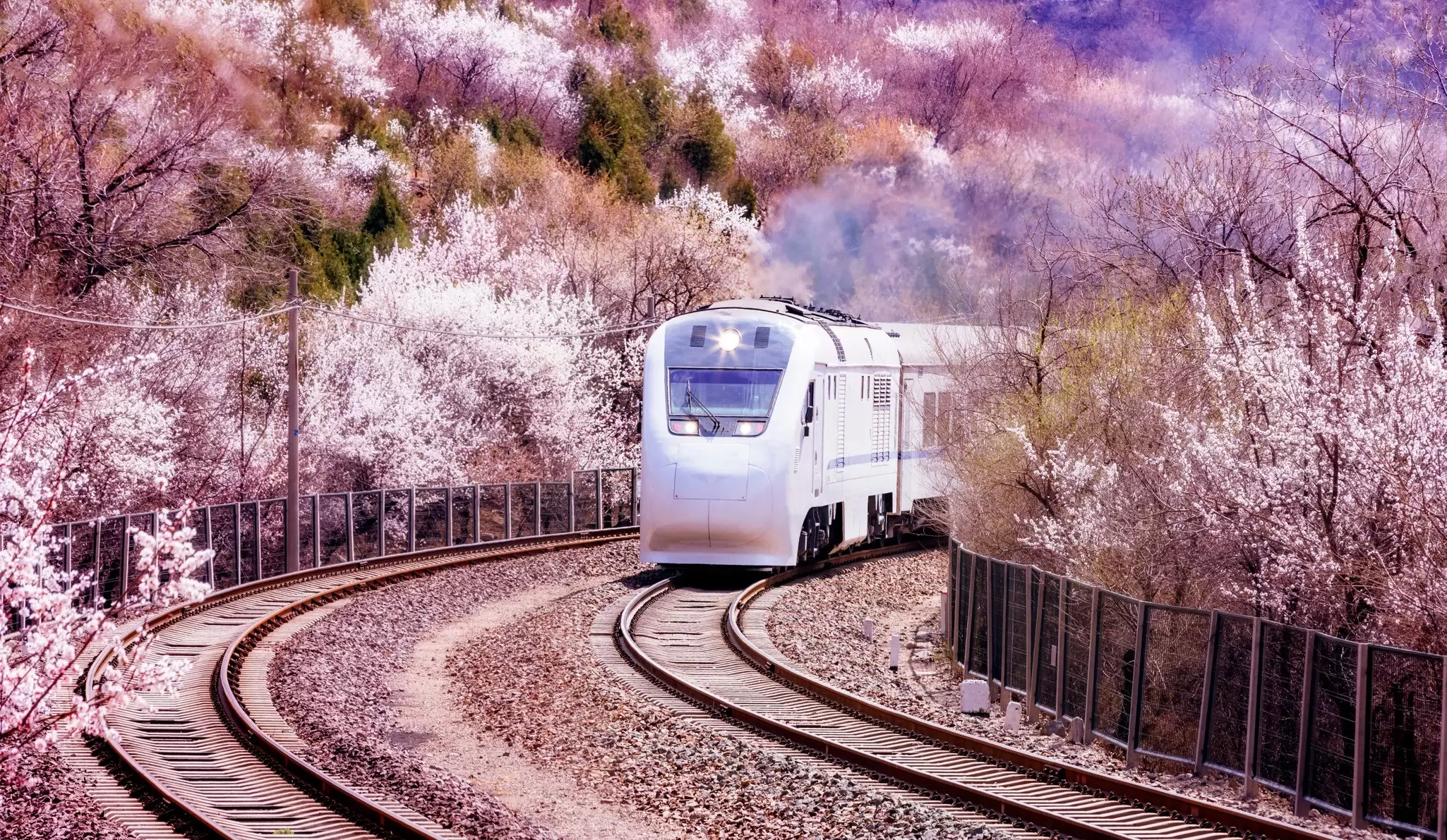 A train traveling through the mountainous landscape of China