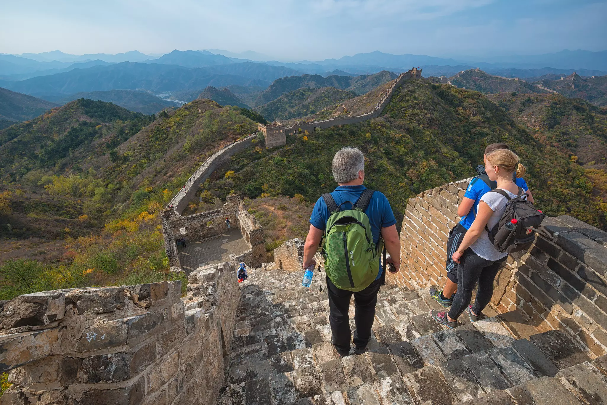 Tourists pausing to admire the view during a hike along the Great Wall near Beijing. Hung Chung Chih/Shutterstock