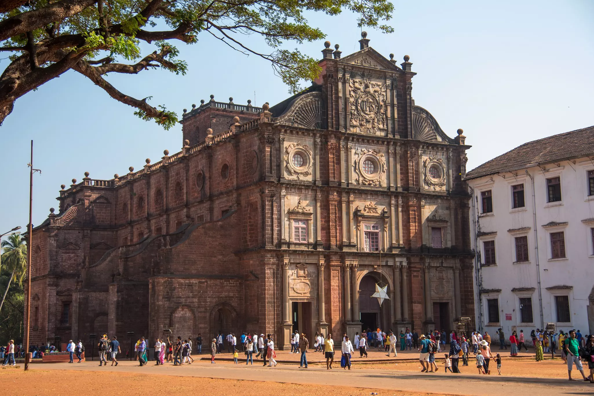 Tourists visits the historic Basilica of Bom Jesus in Old Goa, Goa, India.