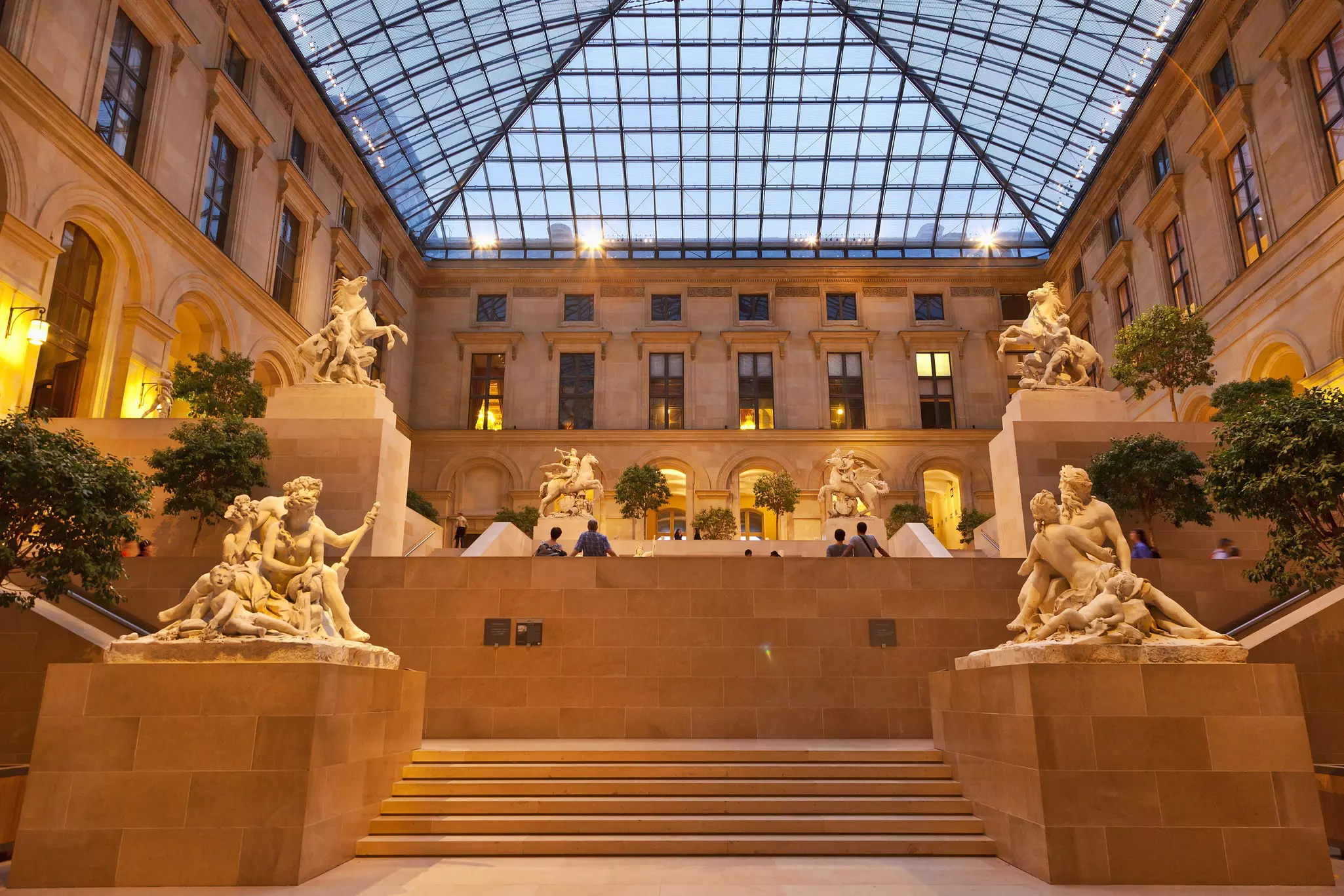 Sculptures in the Marly Court of the Louvre museum. The atrium cover and renovation of the courtyard was designed by I.M. Pei. Paris, France.