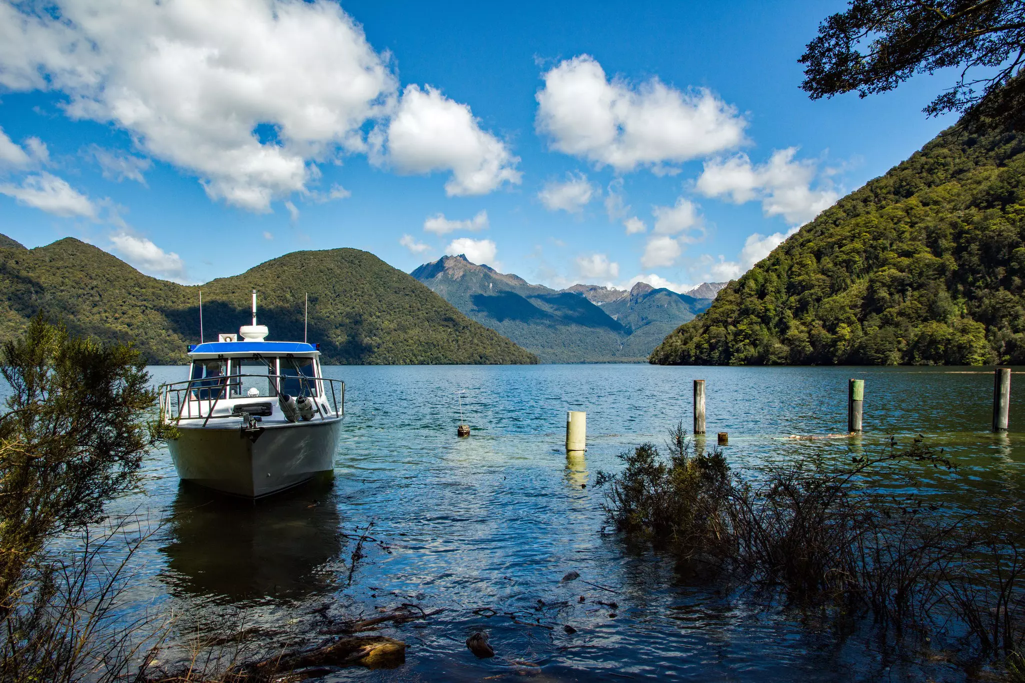 Boat gets ready to leave from Glade Wharf on lake Te Anau after dropping off hikers at the start of the Milford Track.