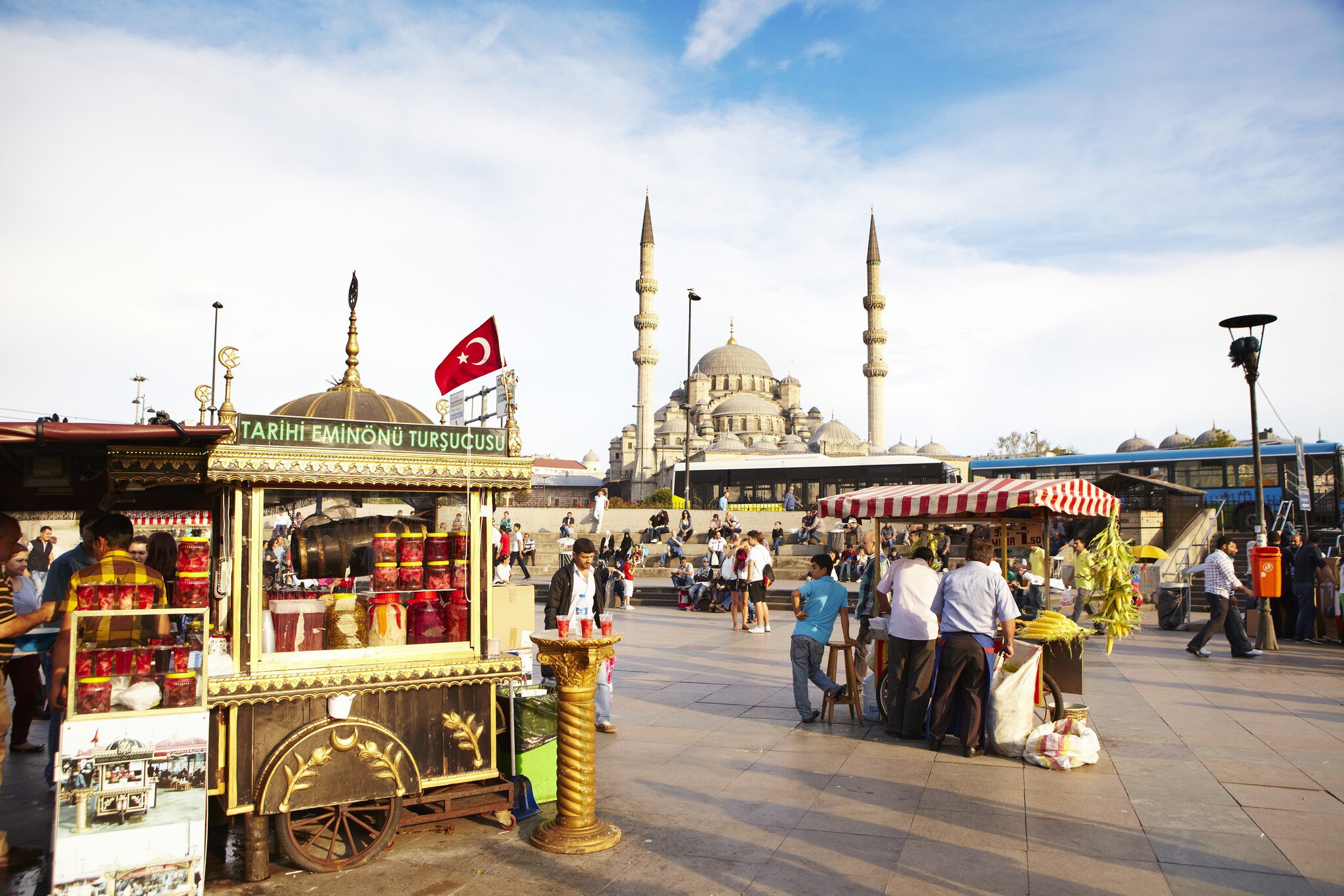 Food stalls on square beside Bosphorus with mosque in background.
Lonely Planet Traveller Magazine, acrosstheplanet, Extras