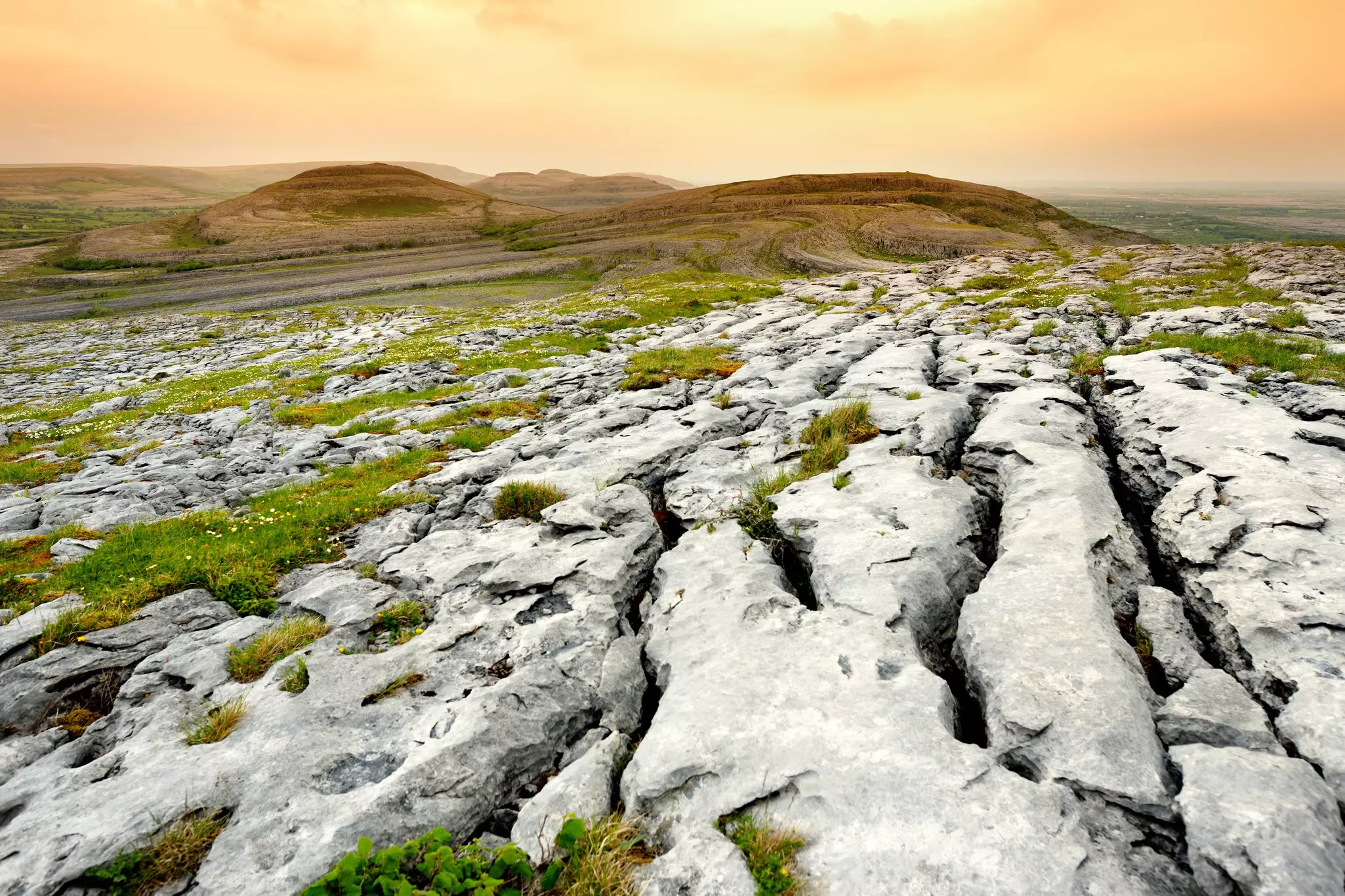 Spectacular landscape of the Burren region of County Clare, Ireland. Exposed karst limestone bedrock at the Burren National Park. Rough Irish nature.