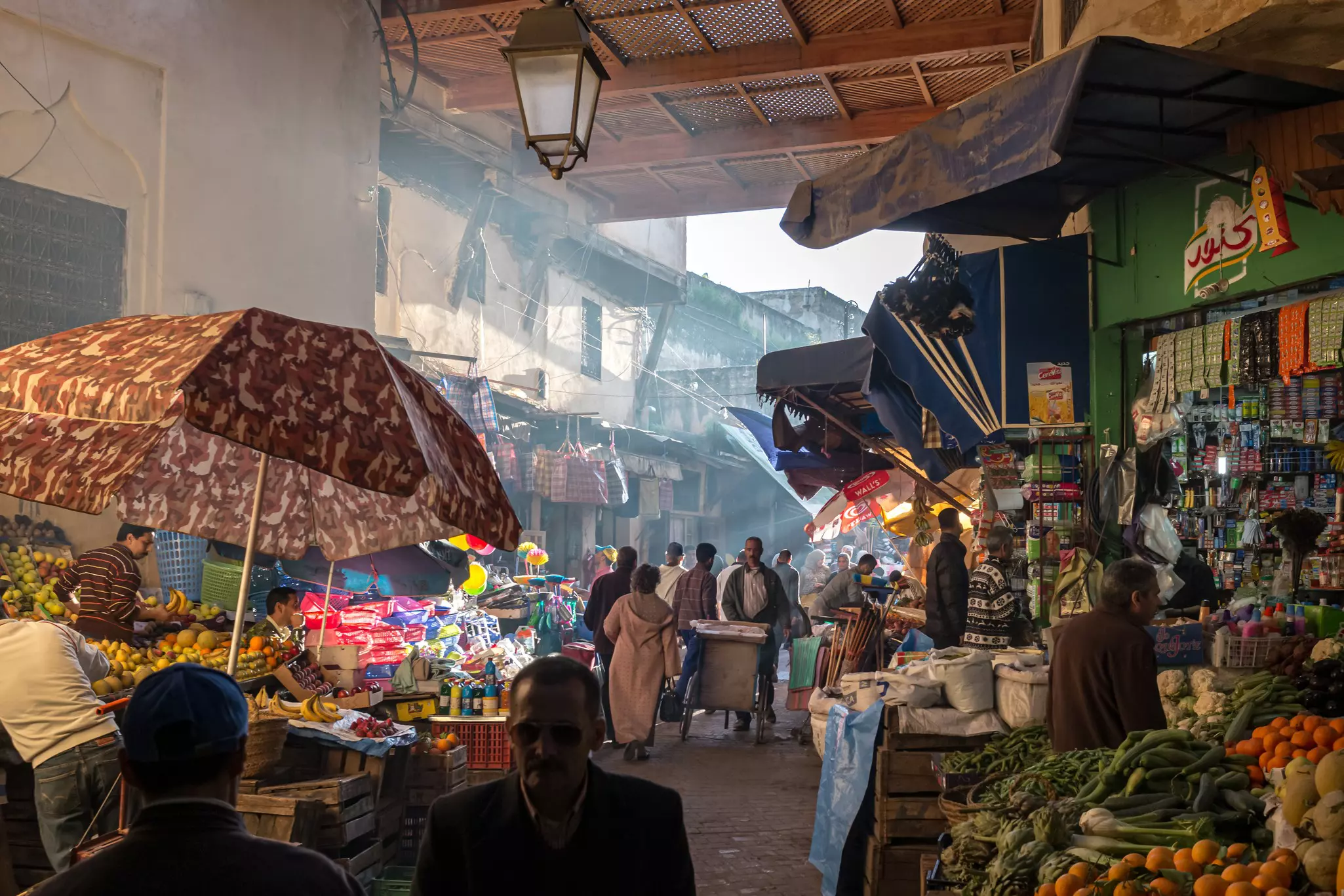 Atmospheric and busy food souk in Medina of Fez, in Morocco.