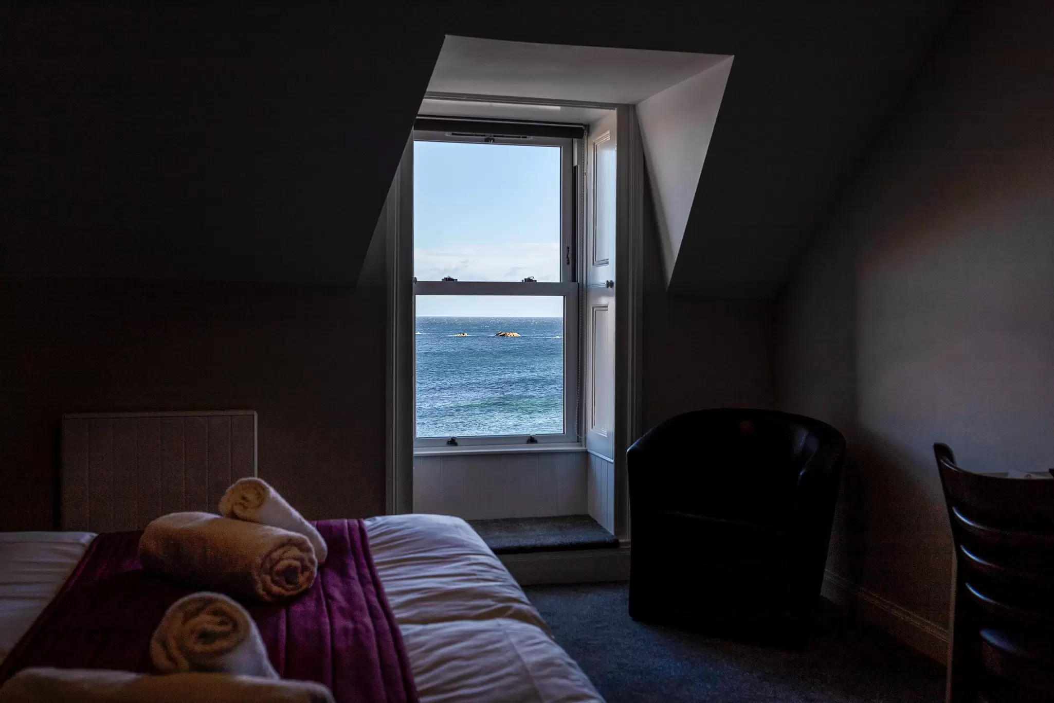 Views of the bay from the Home Arms Hotel, Eyemouth, includes bed and detail in the room in shadow