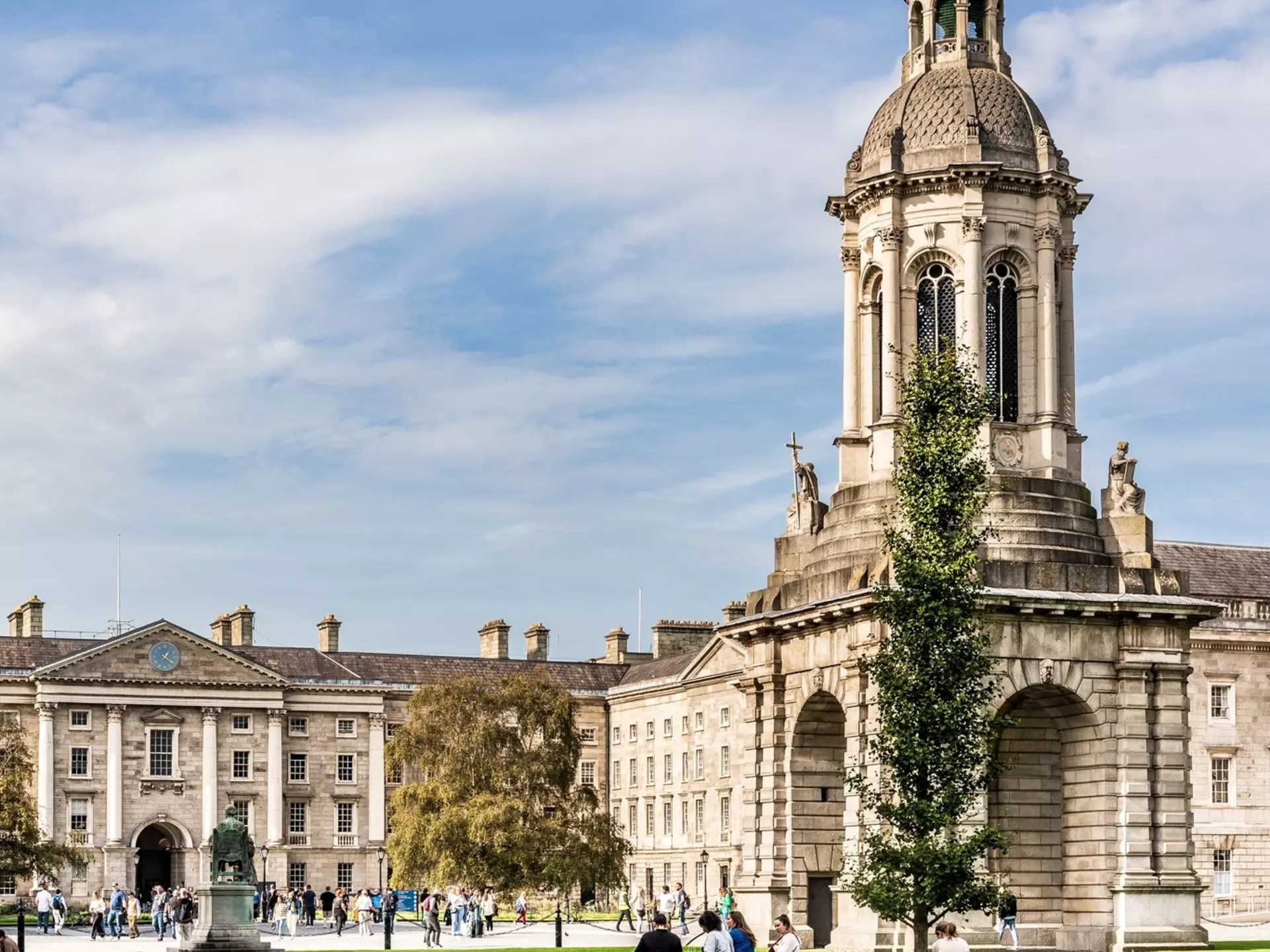 Dublin, Ireland - October 18th, 2023: The Campanile built in mid 19th century by Sir Charles Lanyon, in the Campus of Trinity College, Dublin city center, Ireland, with tourists in a sunny day, License Type: media, Download Time: 2025-08-04T17:35:16.000Z, User: katelyn.perry_lonelyplanet, Editorial: true, purchase_order: 65050 - Digital Destinations and Articles, job: wip, client: wip, other: Katelyn Perry