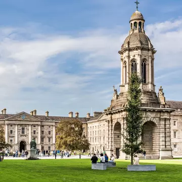 Dublin, Ireland - October 18th, 2023: The Campanile built in mid 19th century by Sir Charles Lanyon, in the Campus of Trinity College, Dublin city center, Ireland, with tourists in a sunny day, License Type: media, Download Time: 2025-08-04T17:35:16.000Z, User: katelyn.perry_lonelyplanet, Editorial: true, purchase_order: 65050 - Digital Destinations and Articles, job: wip, client: wip, other: Katelyn Perry