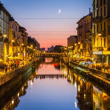 The Navigli district comes alive at night. deimagine / Getty Images