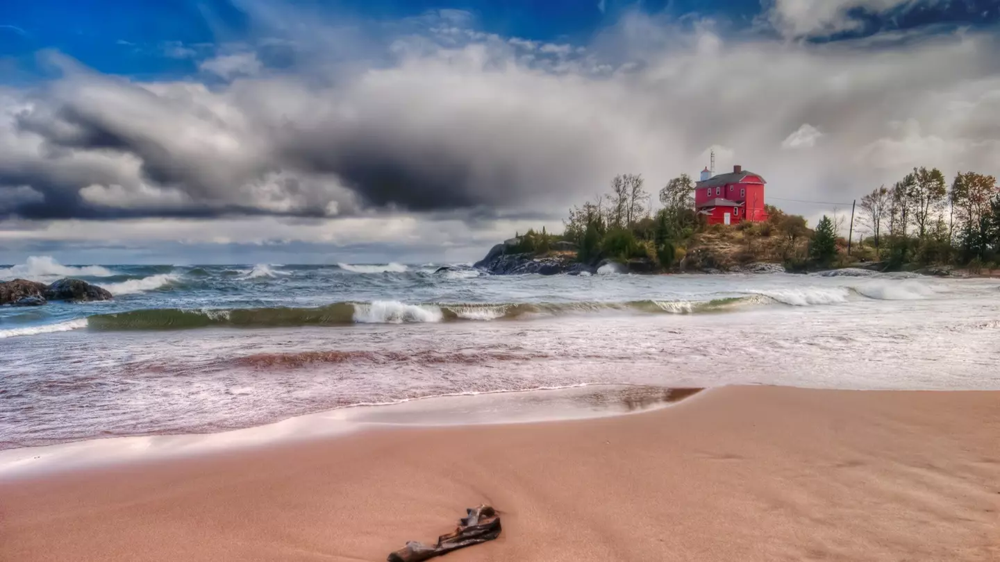 The Coast Guard Lower Harbor Lighthouse stands on an island just off the shores of Marquette, on Lake Superior. Marquette is a hub of adventure travel on Michigan's Upper Peninsula © bperucco / Getty Images