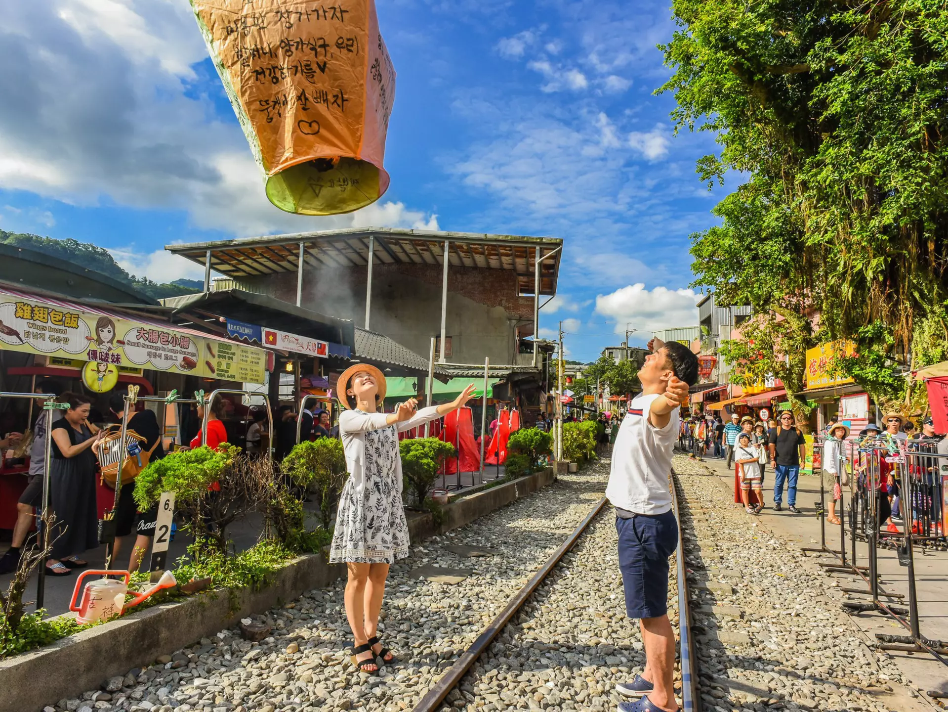 Tourists launching sky lanterns along the Pingxi Railway line near Taipei
676565620
activity, beauty, blue, calm, celebrate, celebration, chinese, countryside, culture, dream, festival, float, fly, hope, japanese, keelung, korean, lantern, launch, light, lucky, peace, peaceful, pingxi, popular, railway, red, rock, ruifang, shifen, sky, stone, taipei, taiwan, tourist, town, traditional, train, trip, village, wishes