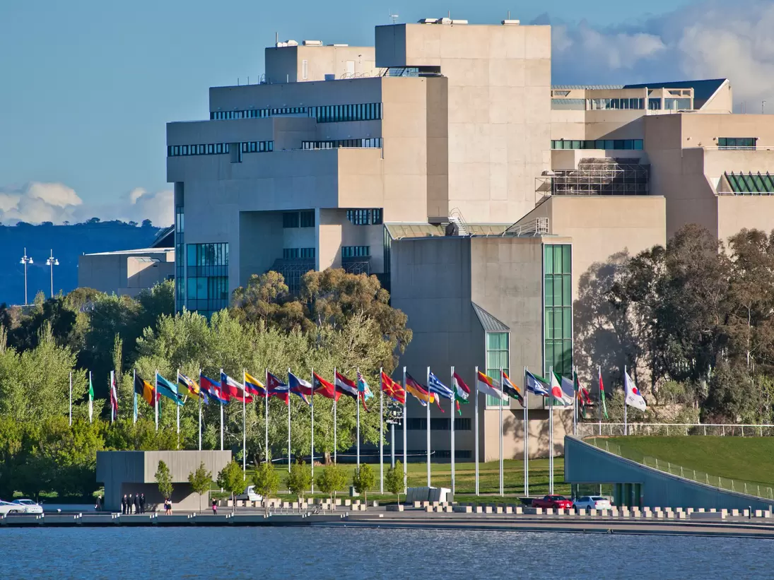 GettyImages-148830038.jpg
Australian National Gallery on the shores of Lake Burley Griffin with international flag display.