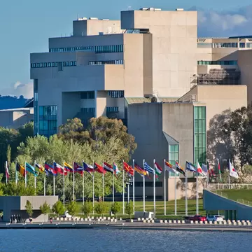 GettyImages-148830038.jpg
Australian National Gallery on the shores of Lake Burley Griffin with international flag display.