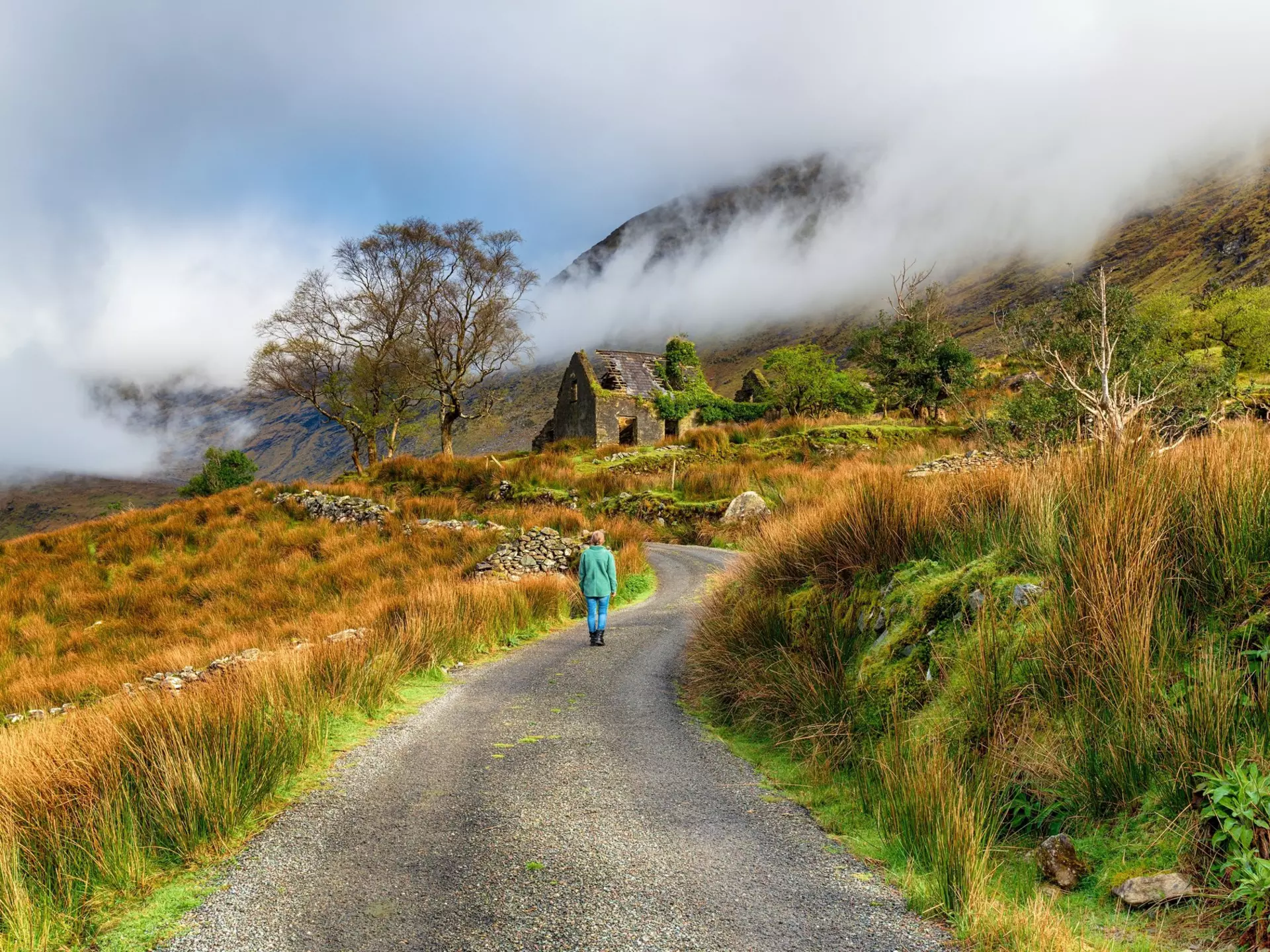 Woman walking towards and abandoned cottage in the mountains of Ireland, License Type: media, Download Time: 2025-03-13T10:56:04.000Z, User: sashabrady26, Editorial: false, purchase_order: 65050 - Digital Destinations and Articles, job: Lonely Planet , client: Photo Haul, other: Sasha Brady
