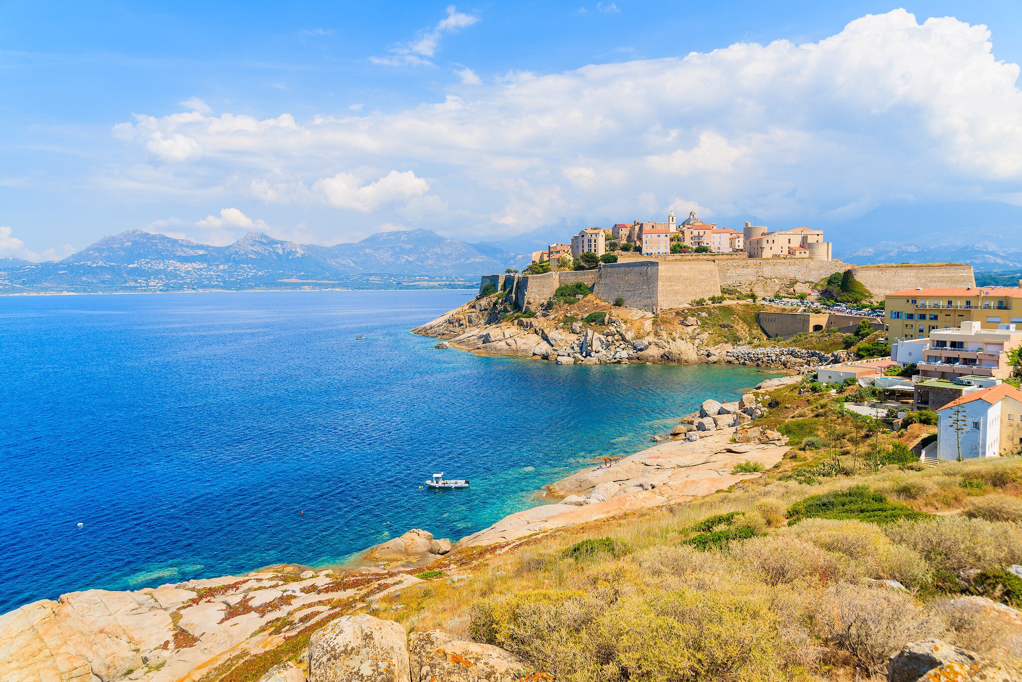 View of citadel with houses in Calvi bay, Corsica island, France.   