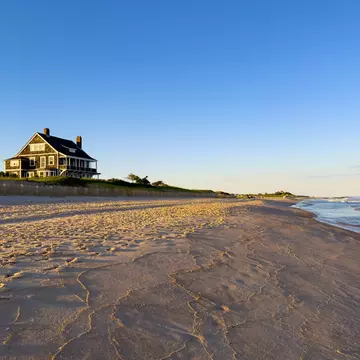 A wide stretch of quiet beach. Shutterstock