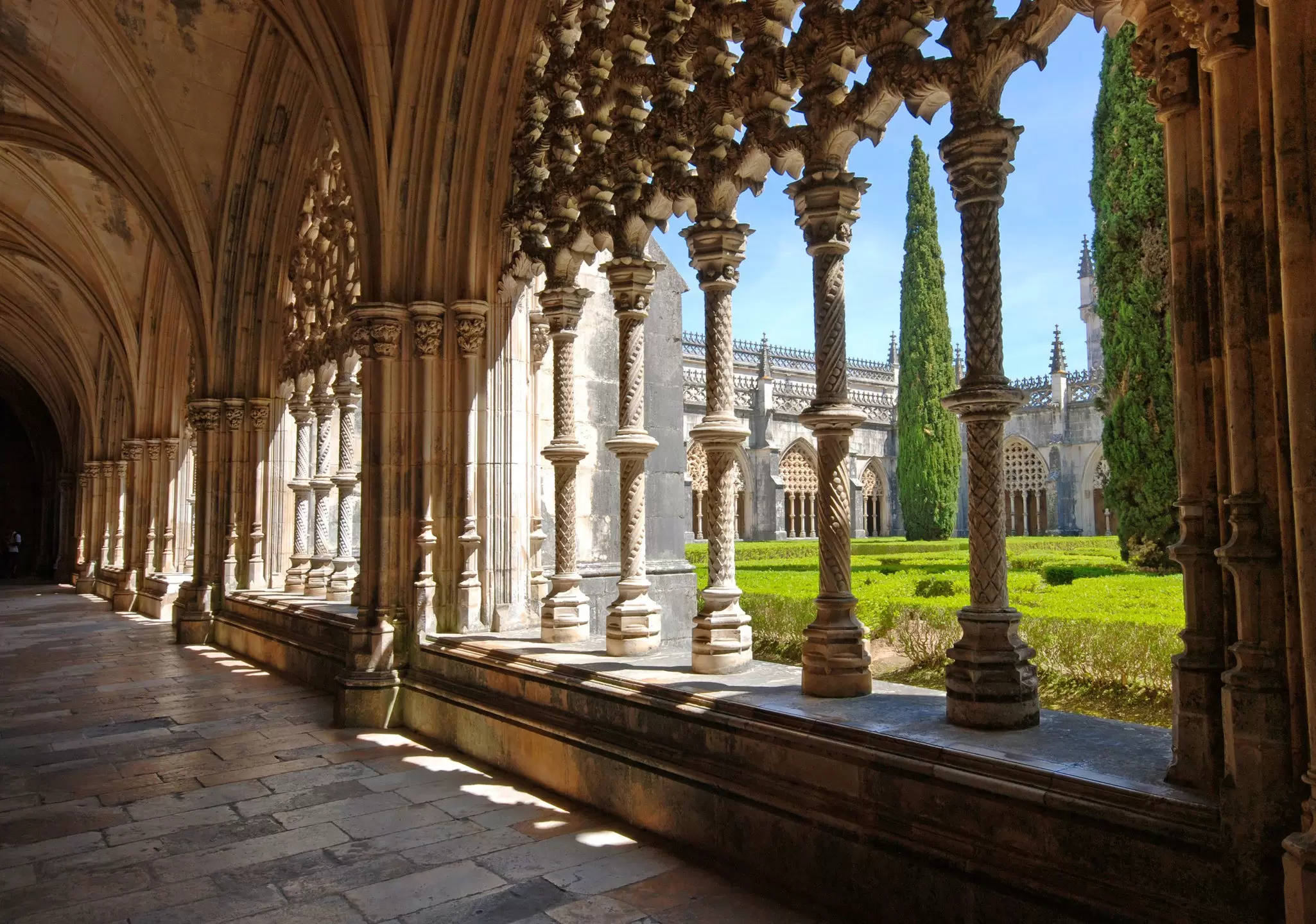 View of the cloisters and garden at the Mosteiro da Batalha in Portugal.