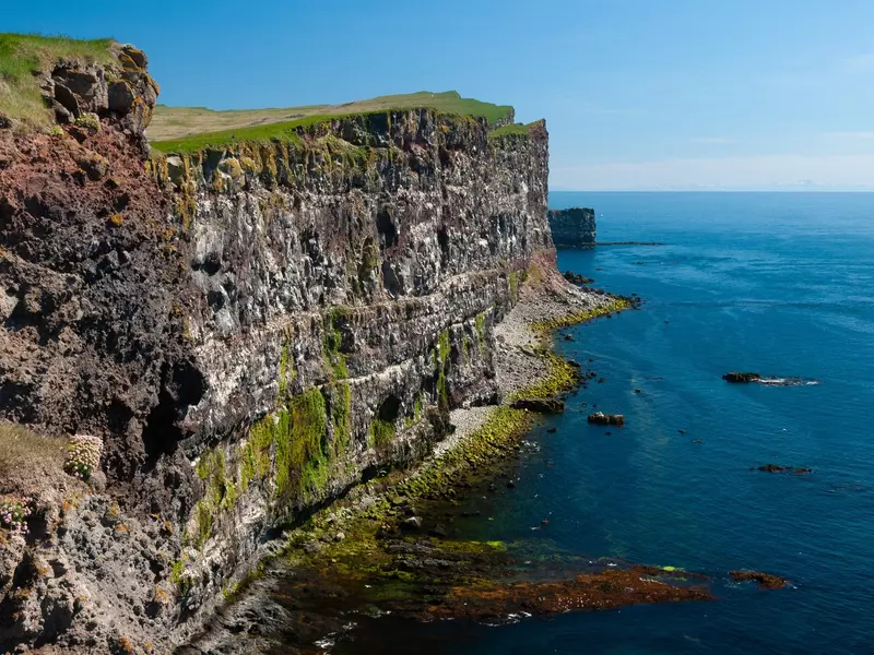Látrabjarg is a cape with cliffs extending over 14 km of coastline, the highest point reaching 444 m. In addition to being the westernmost point of Europe.  The largest seabird cliff in Iceland., 