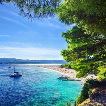 A few boats near the beach of Zlatni Rat (Golden Horn) on the island Brac.
562748494
outdoor, pebble, island, coast, clear, shore, seaside, travel, view, cape, rocky, holiday, sunny, summer, yacht, dalmatia, picturesque, pines, wonderful, beach, famous, croatia, blue, empty, sky, bay, scenic, tourism, adriatic, mediterranean, sea, beautiful, turquoise, water, nature, coastline, idyllic, vacation, europe, boats, landscape, golden cape, zlatni rat, brac