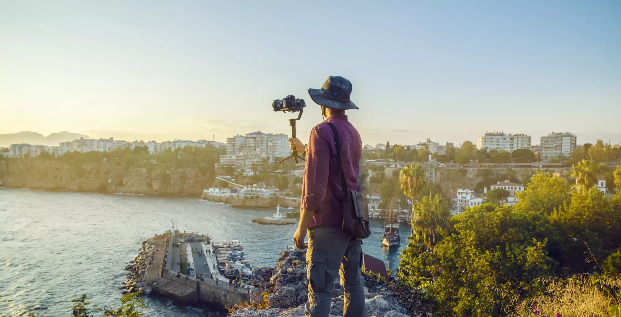 Traveller filming city of Antalya with gimbal at sunset.
1037973906
Movie, Adults Only, Young Adult, Hobbies, One Man Only, Working, Antalya City, Adult, Filming, Sea, Vlogging, Photographer, Photographing, Turkey, Document, Film Industry, Nature, Travel, Outdoors, Only Men, Camera Operator, Leisure Activity, Equipment, Hat, Home Video Camera, Photography Themes, Vacations, Film, One Young Man Only, Horizontal, Holding, Sunset, Photograph, steadycam, Recreational Pursuit, People, Expertise, Turkey - Middle East, Young Men, Photographic Equipment, Gear, Professional Occupation, Lifestyles, One Person, Journalist, Occupation, Arts Culture and Entertainment, Camera - Photographic Equipment, Digital Single-Lens Reflex Camera, Tourist, Monopod, Video, Video Still, Tourism, Camera Film, Photography