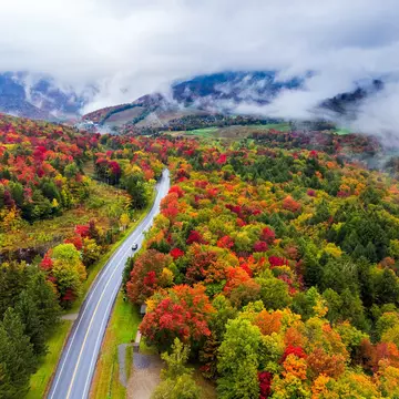Driving through Vermont in fall. Chun Chen/500px/Getty Images