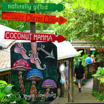 Signs at the Original Kuranda Rainforest Market, a folk art and food market located in the rainforest village of Kuranda near Cairns in Far North Queensland, Australia.