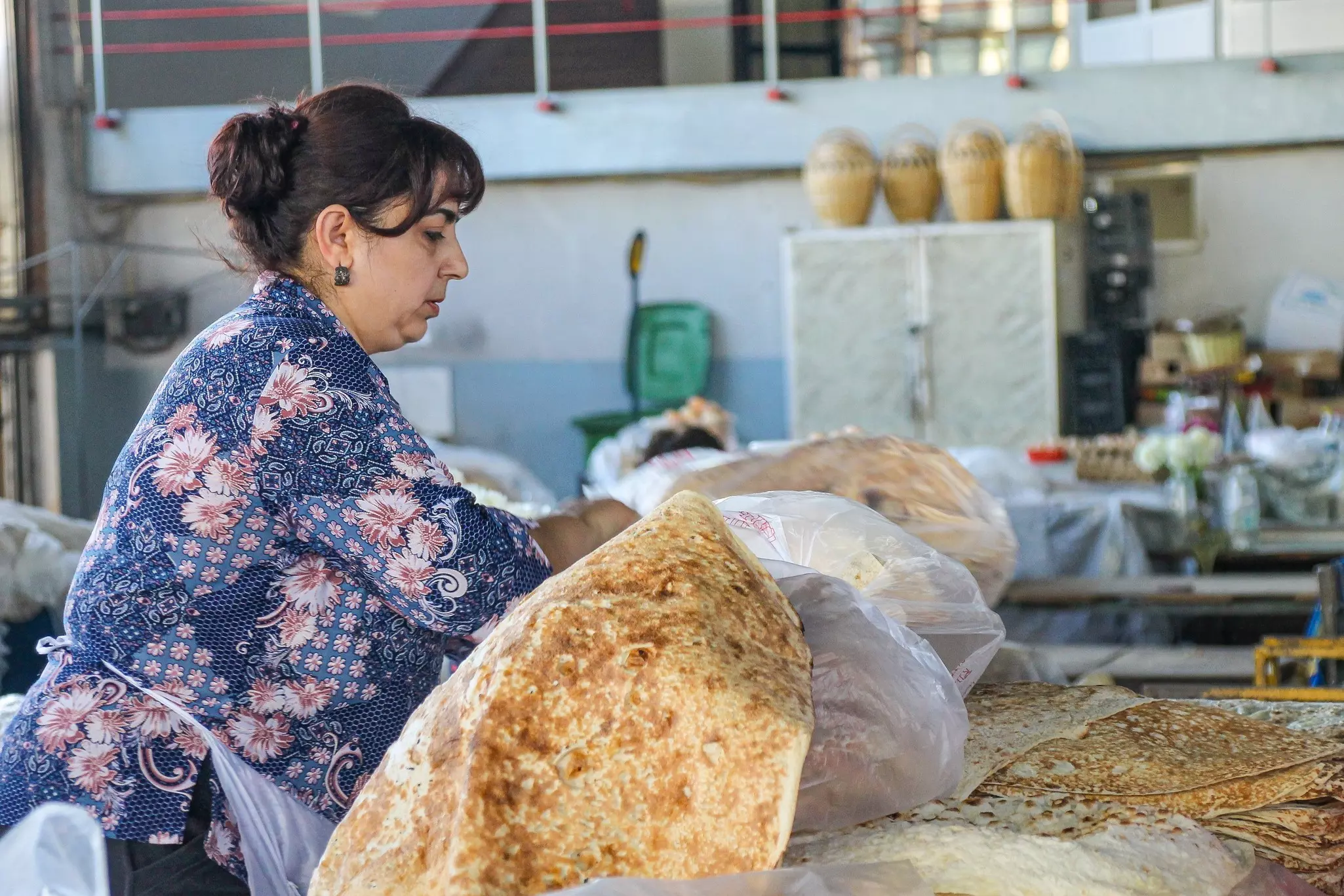 The people of Armenia. Local woman selling food in the street markets.