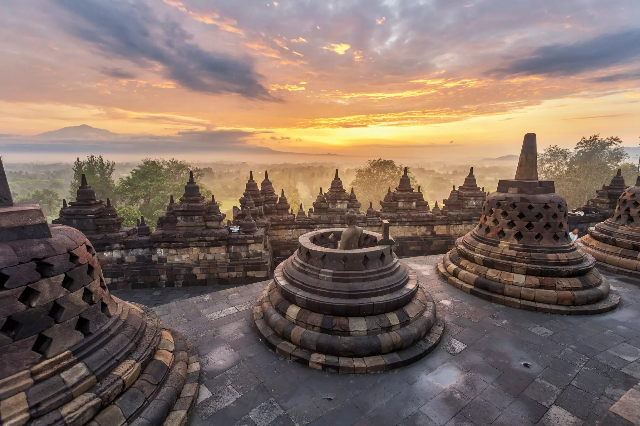 Dramatic and colourful sunrise seen from the Borobudur, Java, Indonesia.