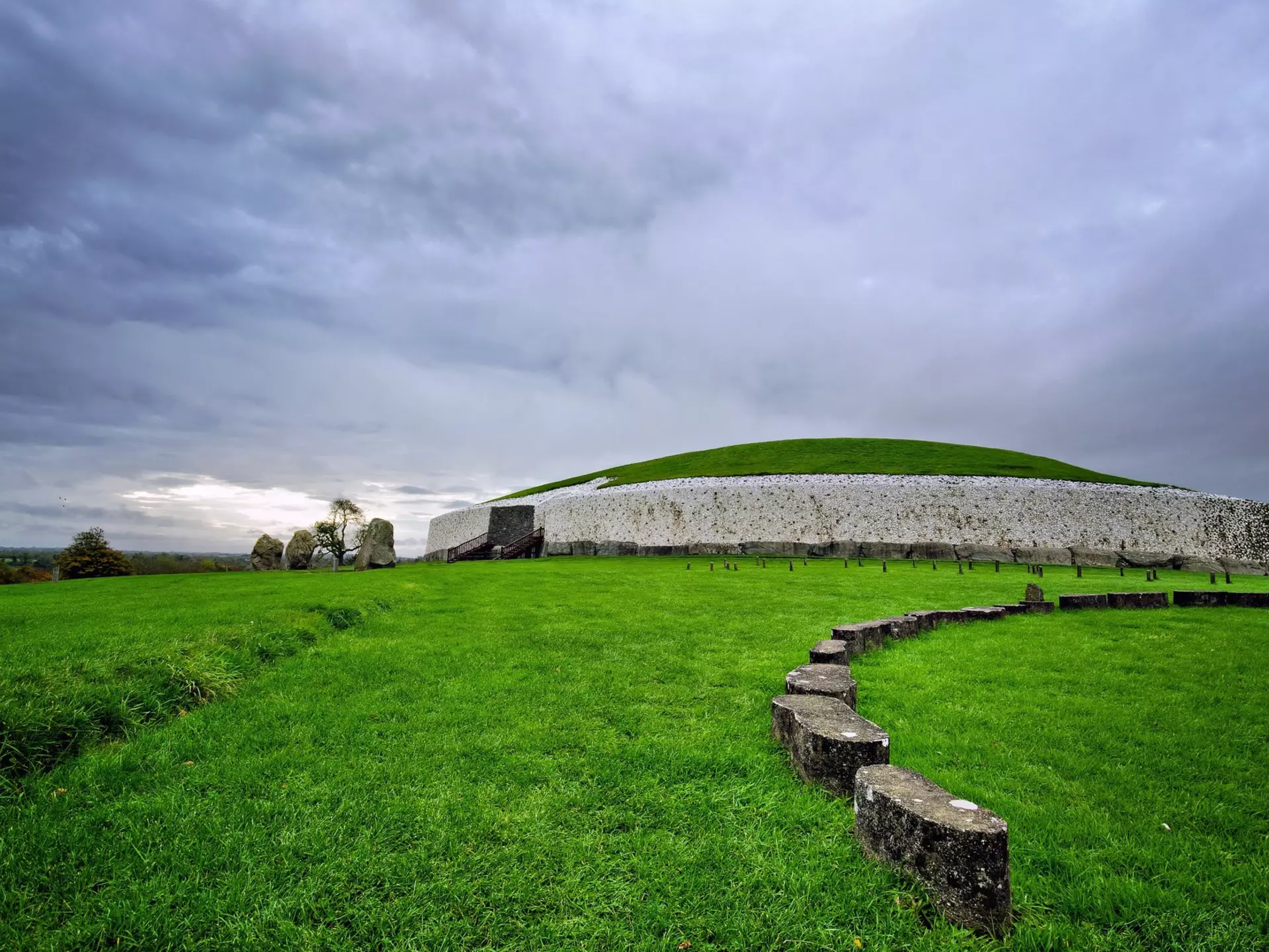 Newgrange Megalithic Passage Tomb with gray skies above