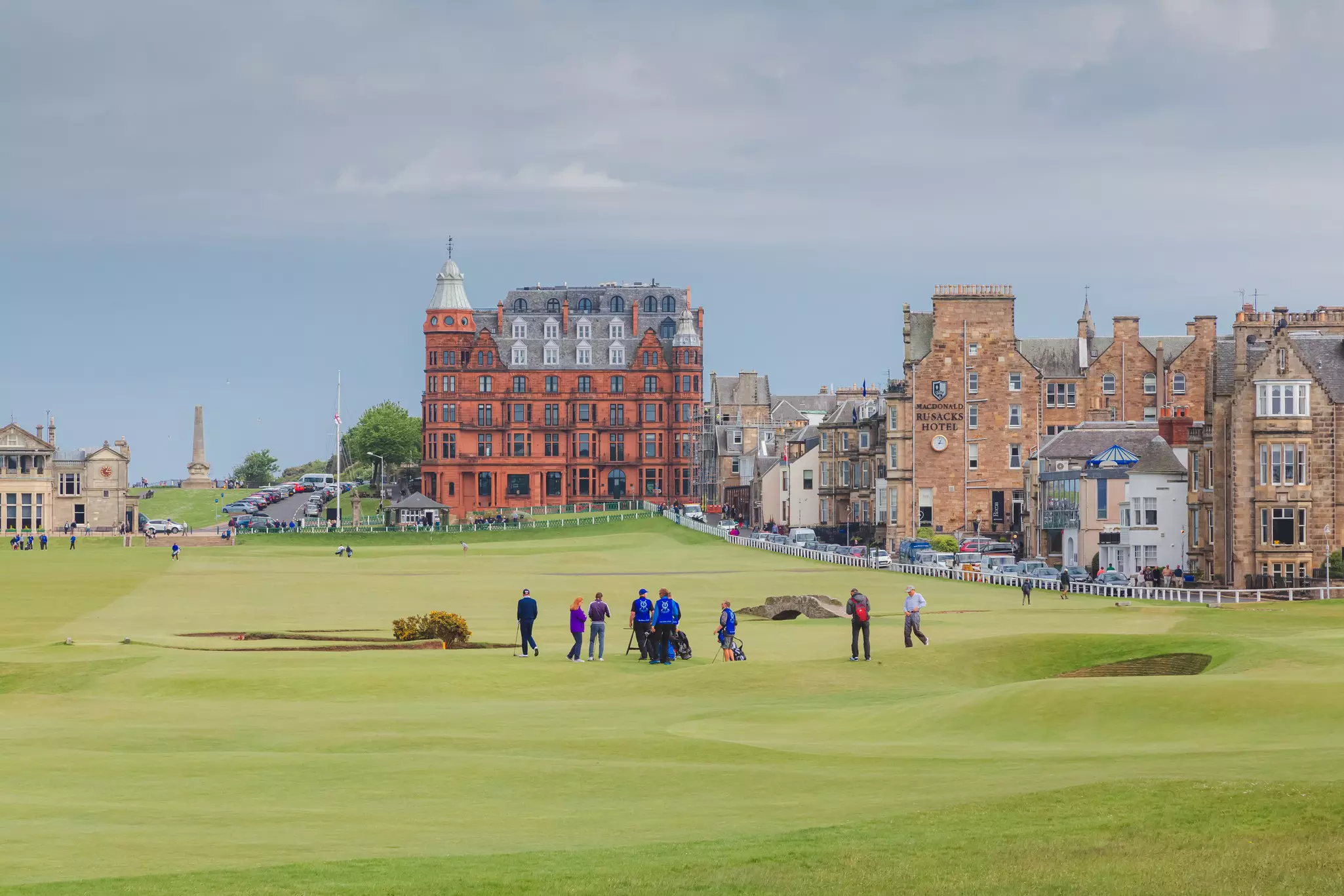 St Andrews, Scotland - May 30 2016: A view of down the 18th hole of the historic Old Course at St. Andrews Links in Fife, Scotland  License Type: media  Download Time: 2021-03-29T02:05:53.000Z  User: mvm_lonelyplanet  Is Editorial: Yes  purchase_order:   