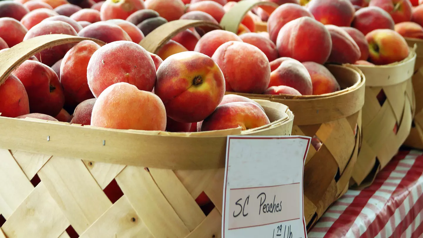 Baskets of peaches from South Carolina on sale at a local farmer's market