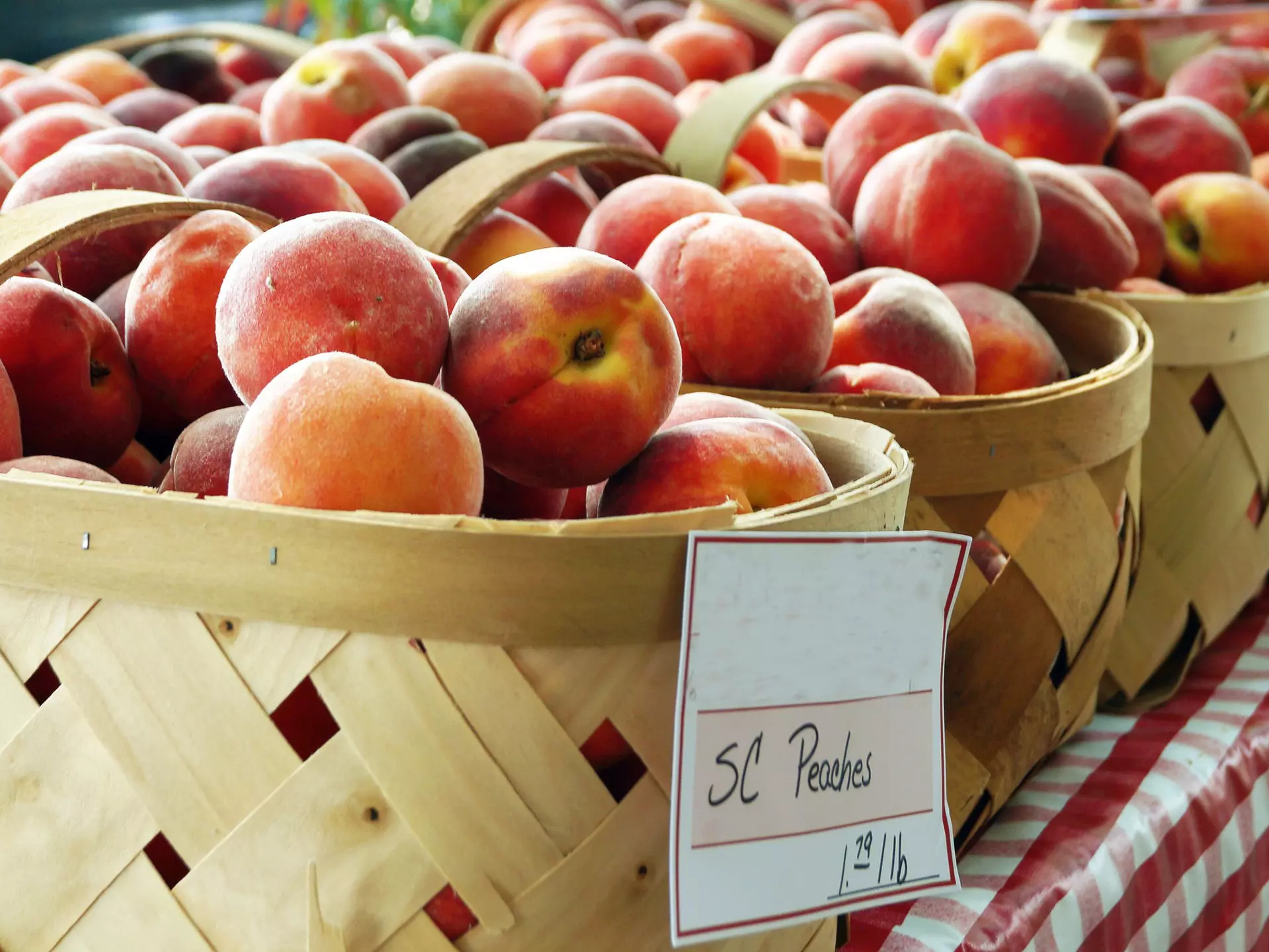 Baskets of peaches from South Carolina on sale at a local farmer's market