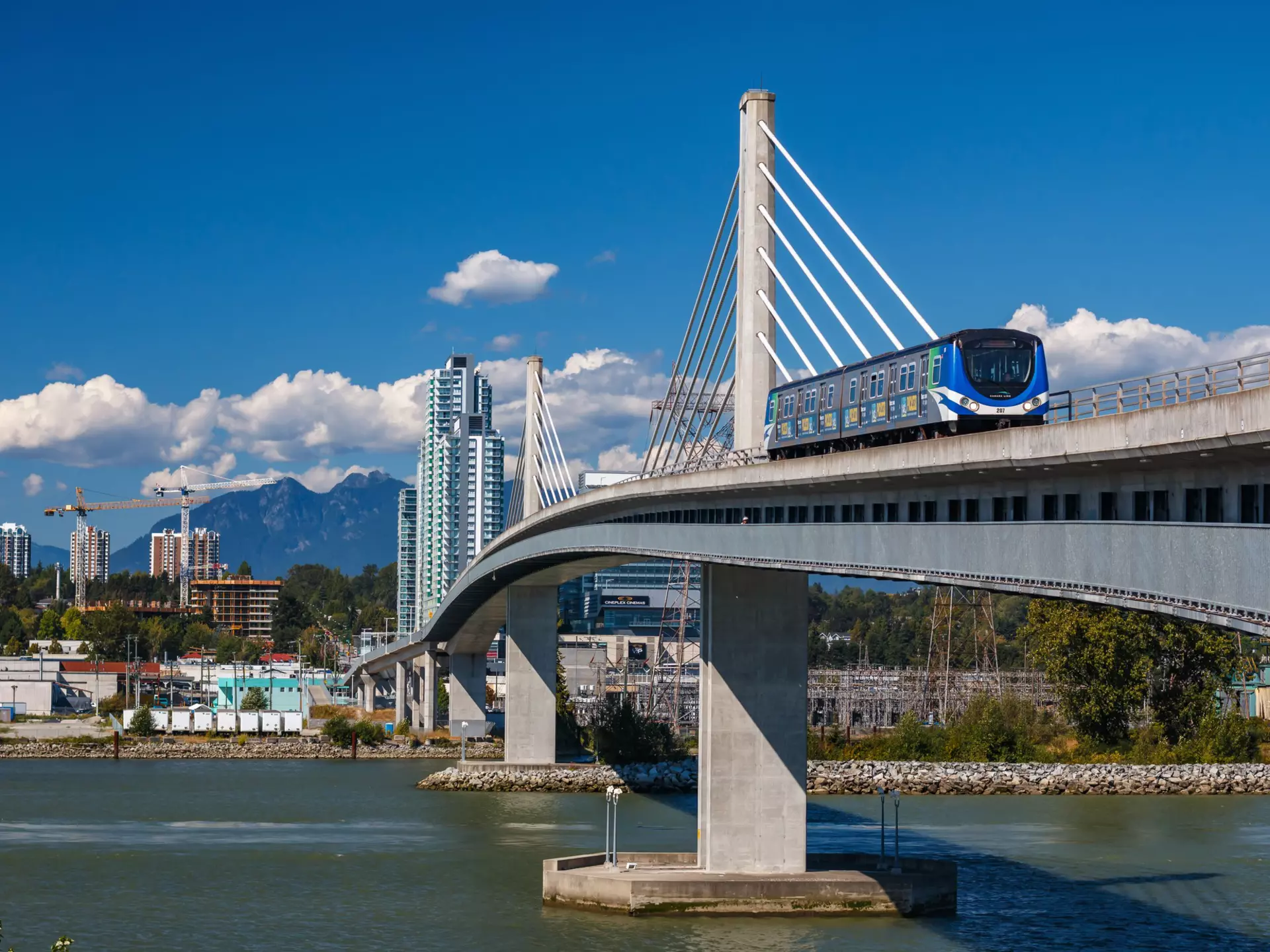 VANCOUVER, CANADA - AUGUST 11, 2016: Canada  Line train passes bridge on August 11, 2016. The Canada Line is Vancouver's new rapid transit rail link connecting airport to downtown Vancouver., License Type: media, Download Time: 2025-12-02T17:28:21.000Z, User: mvm_lonelyplanet, Editorial: true, purchase_order: 56530 - Guidebooks, job: Experience Canada 1, client: Global Publishing-WIP, other: Virginia Moreno