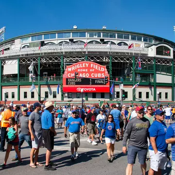 Fans walking in front of Wrigley Field in Chicago, Illinois.