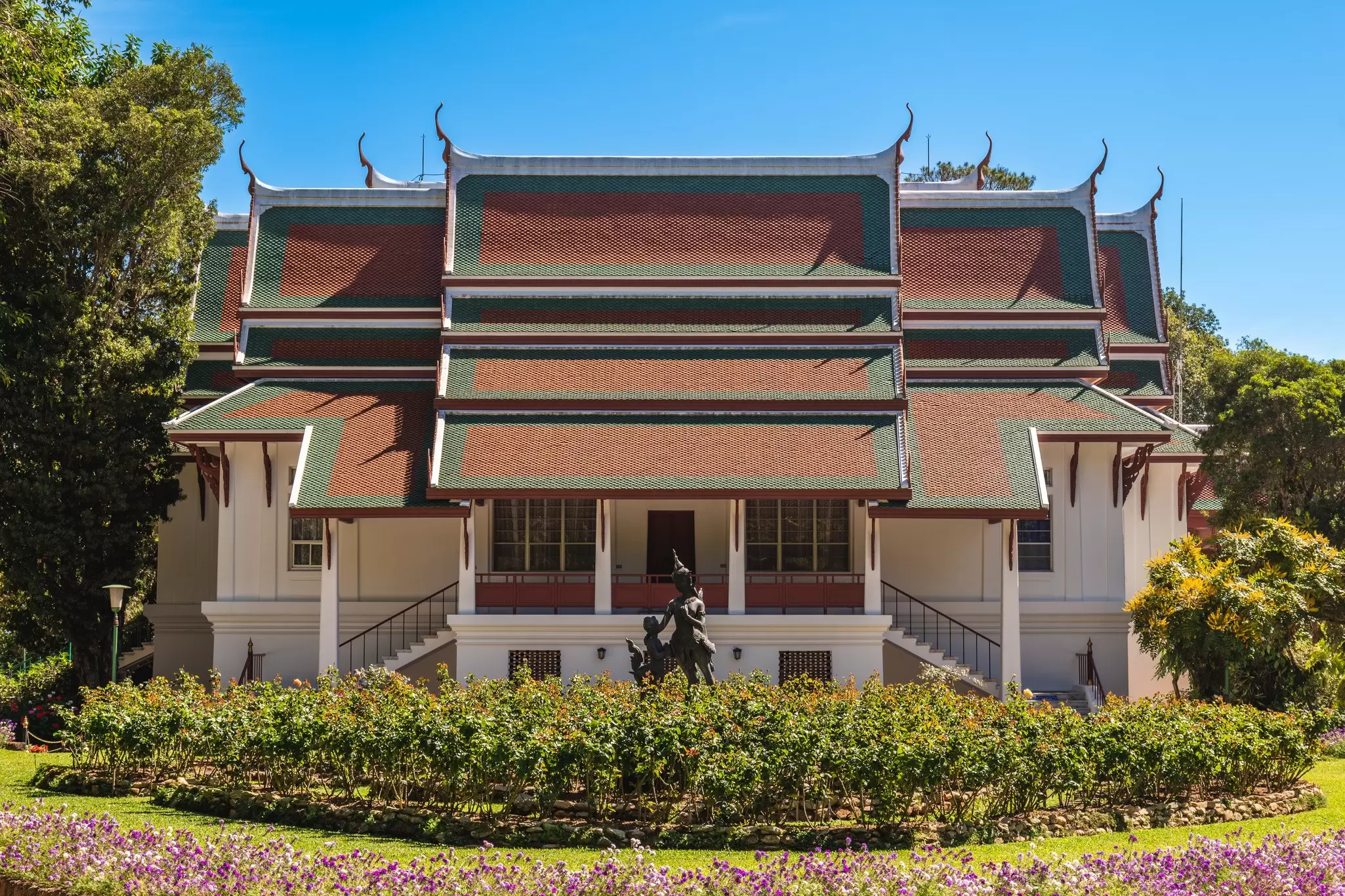 Exterior view of the Bhubing Palace on a sunny day in Chiang Mai, Thailand.