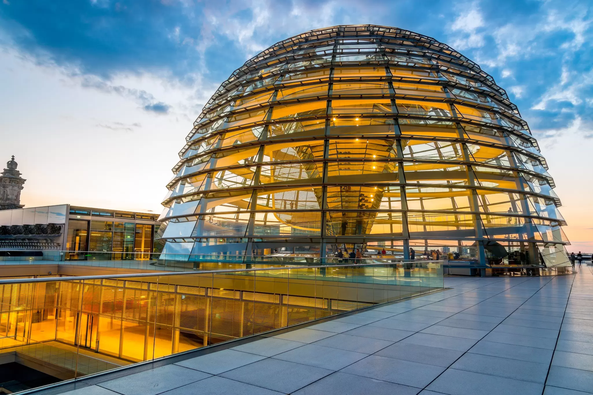 Illuminated Reichstag dome at twilight.
