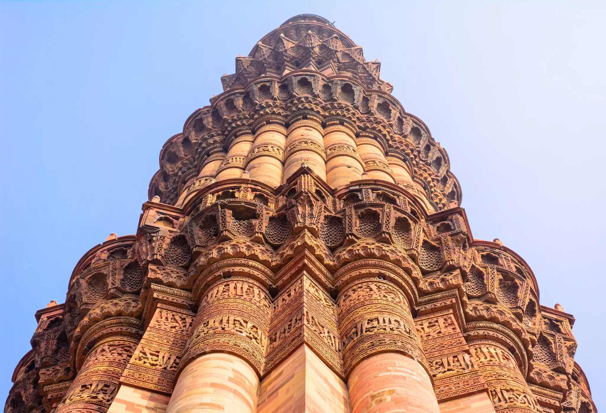 Intricate carvings adorn the towering Qutb Minar at Mehrauli, the tallest free-standing stone tower in the world. Sumit.Kumar.99/Shutterstock
