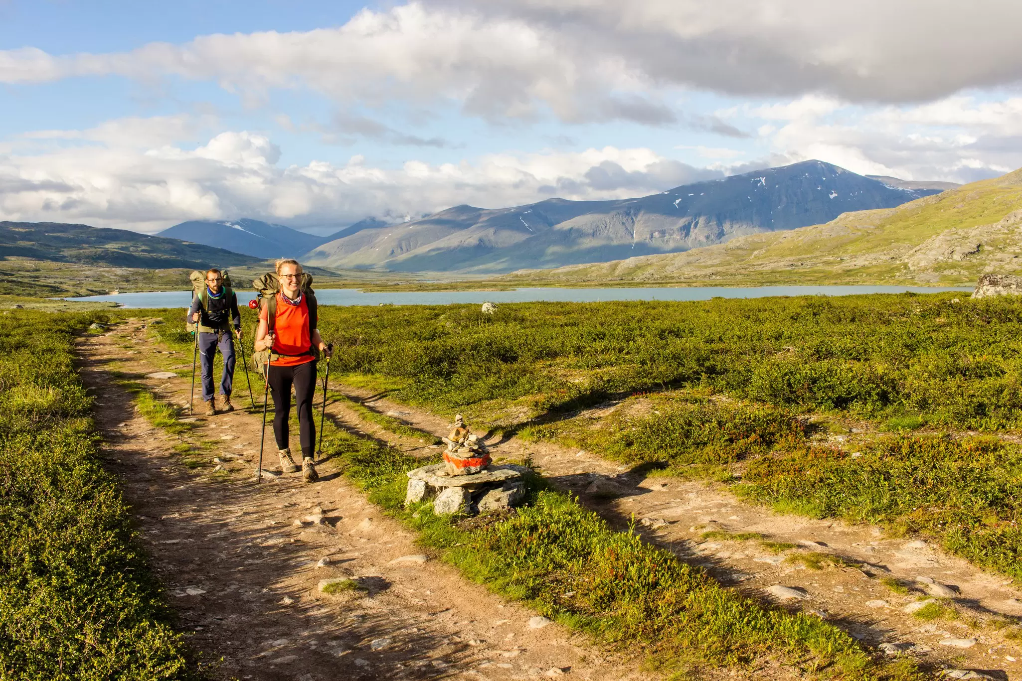 Couple hiking in Swedish north going for the hut.  Side light makes this photo warmer, License Type: media, Download Time: 2025-02-07T08:35:23.000Z, User: pinkjozie64, Editorial: false, purchase_order: 56530 - Guidebooks, job: Global Publishing WIP (for books) , client: Sweden 9, other: Jo-anne Riddell